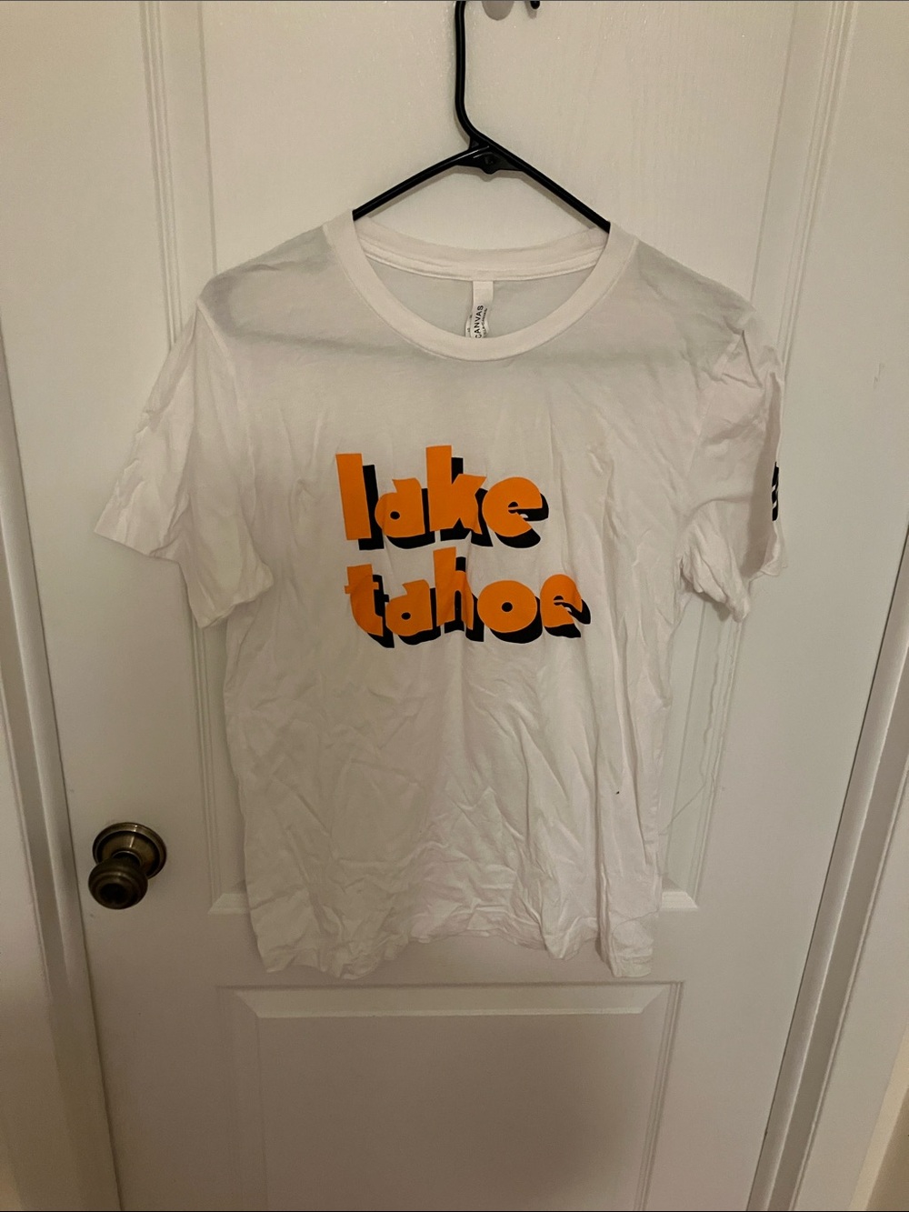 Bella Canvas White Tee with Orange and Black 'Lake Tahoe' Graphic